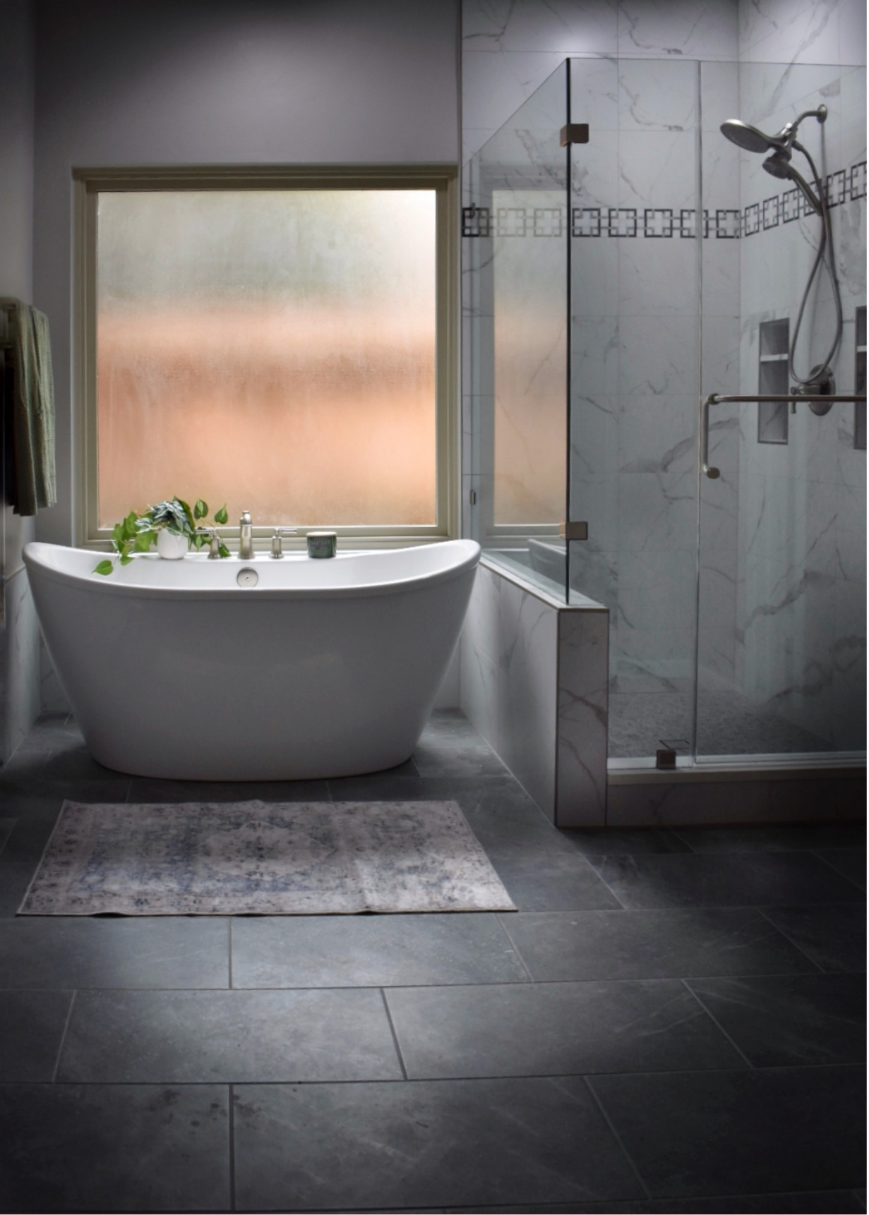 Remodeled bathroom with freestanding tub and glass walk-in shower
