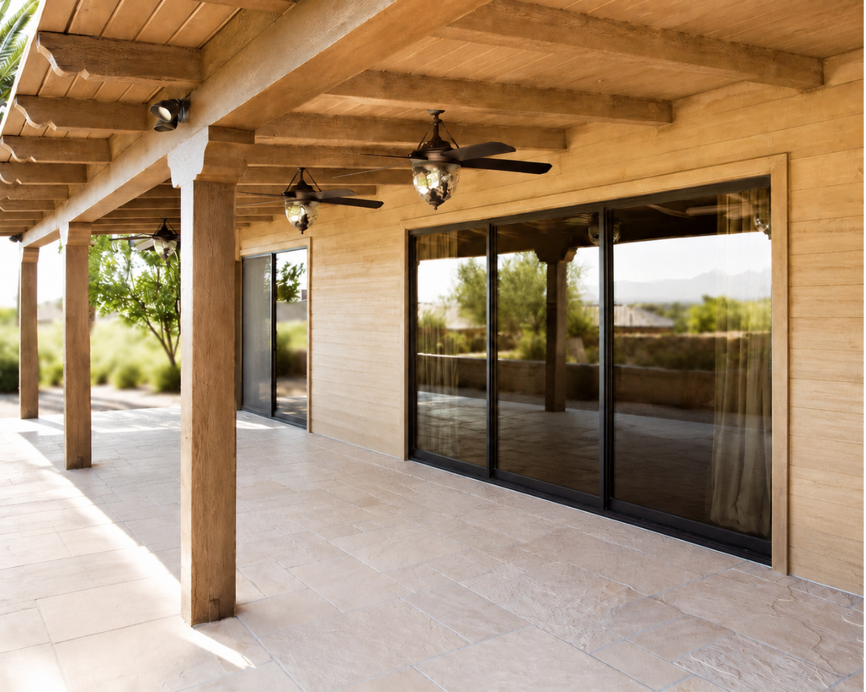 Covered back patio with cedar ceiling and sliding glass doors