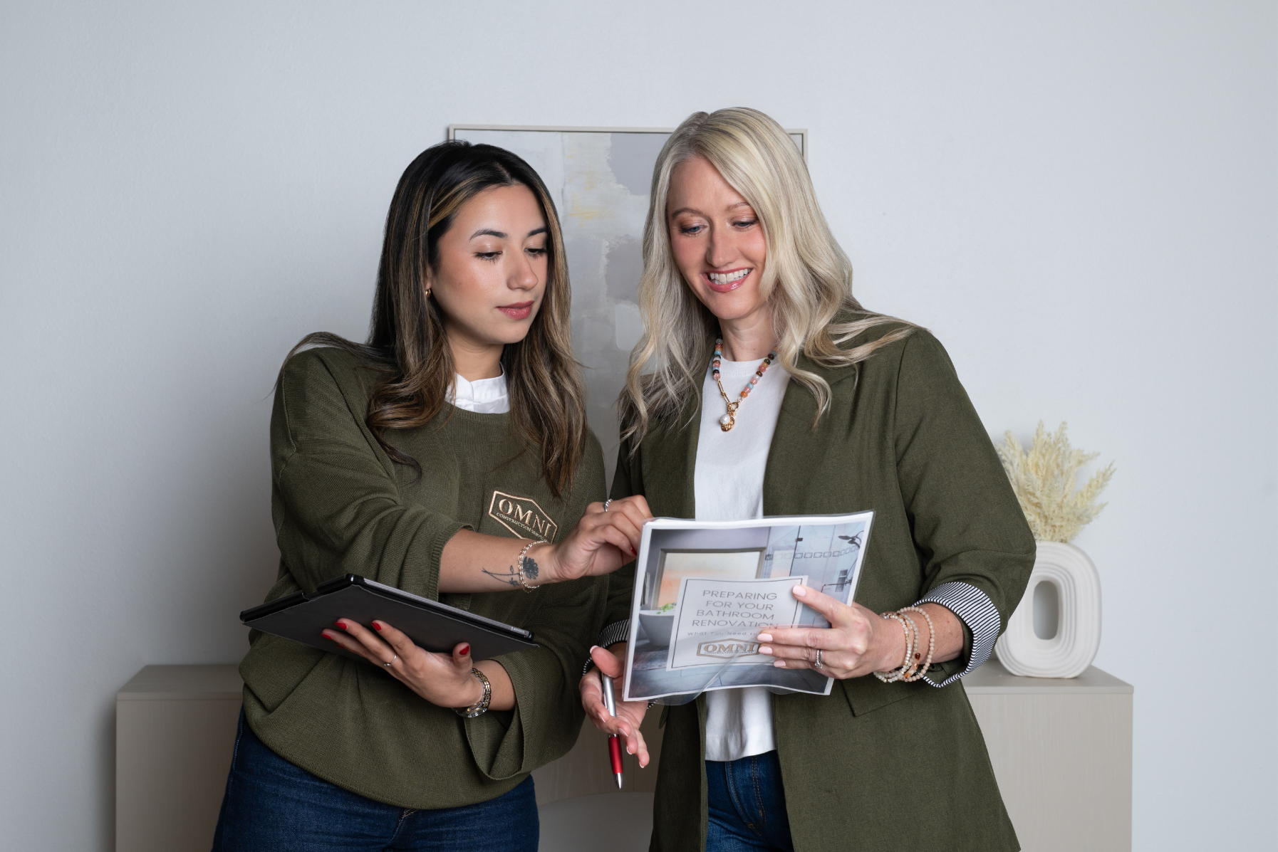 Real estate professionals reviewing property information